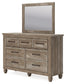 Yarbeck Queen Panel Bed with Mirrored Dresser and 2 Nightstands